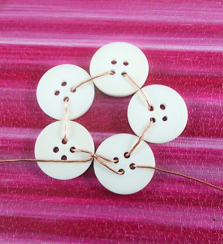 Detail of using wire to attach central buttons