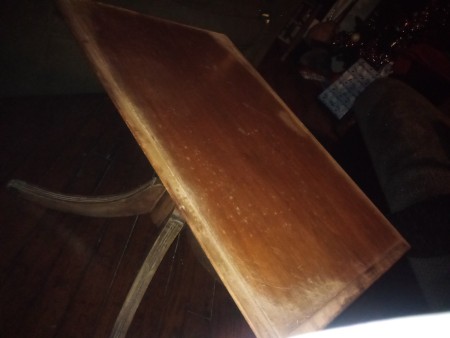 The top of the table under the artwork.