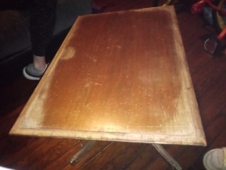 The top of the table under the artwork.