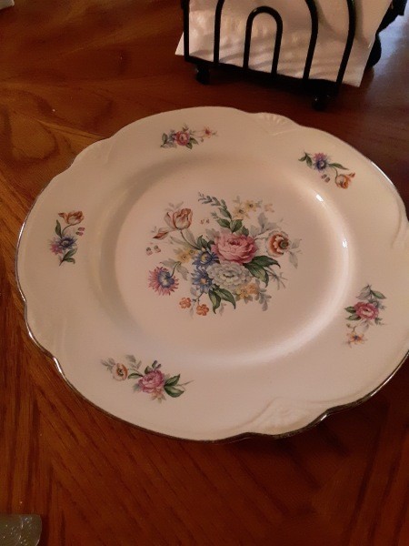 A china plate with a floral pattern.
