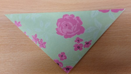 Folding the paper in half.