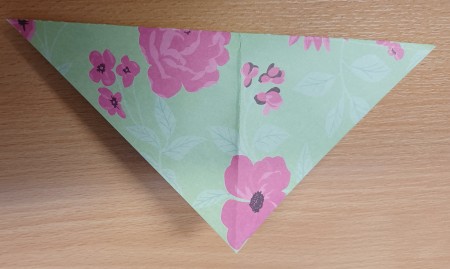 The folded piece of paper.