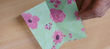 The unfolded piece of paper.