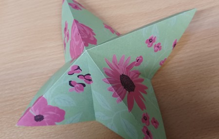 The paper folded into a star shape.