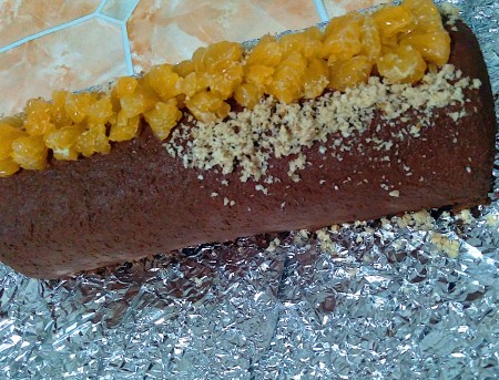 Adding chopped nuts to the roll.