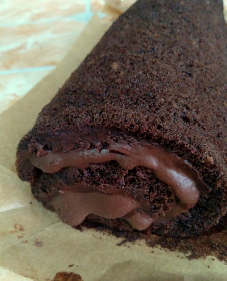 Rolling the cake together.