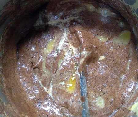 Mixing together the cake batter.