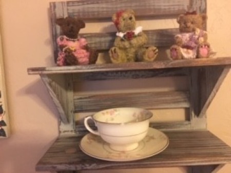 Teddy bears on a shelf.