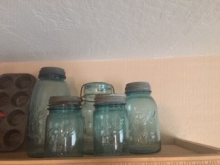 A collection of old glass jars.
