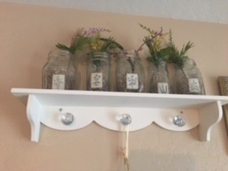 Herbs growing in jars.