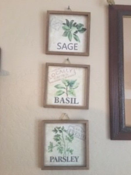 Three decorative pictures of herbs.