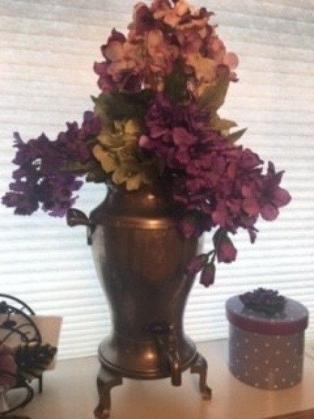 A decorative vase with flowers.