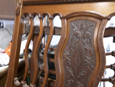 Close up of a wooden headboard.
