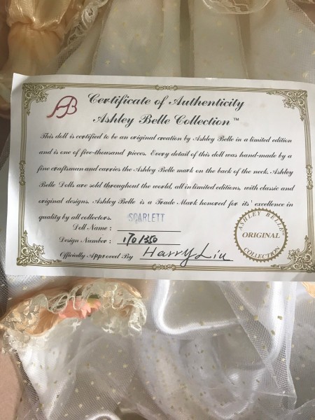 A certificate of authenticity for a porcelain doll.