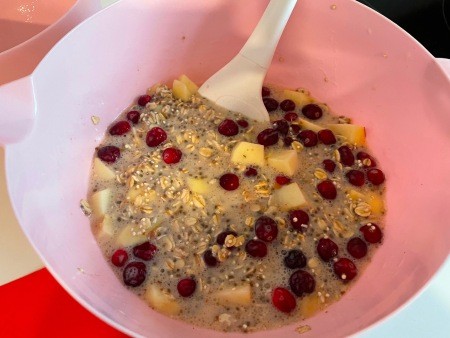 Adding fruit to the mixture.