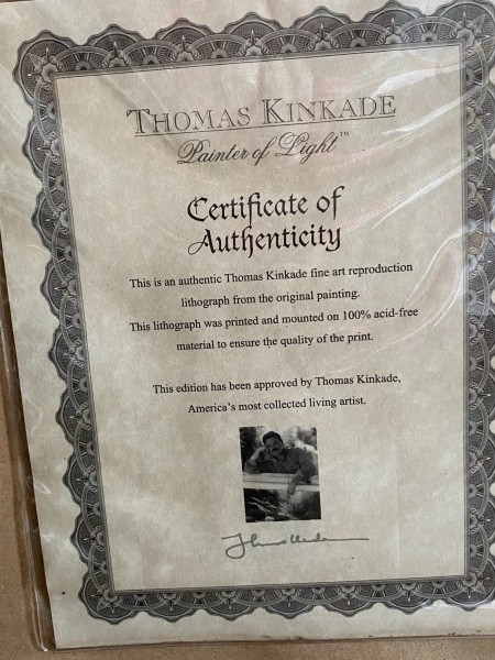The certificate of authenticity for a Thomas Kincade print.
