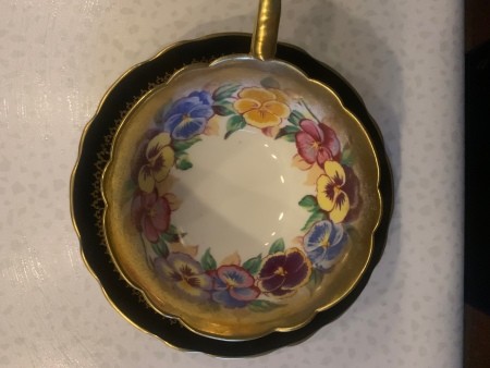 The painted inside of a china tea cup.