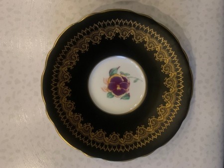 The black saucer for a china tea cup.