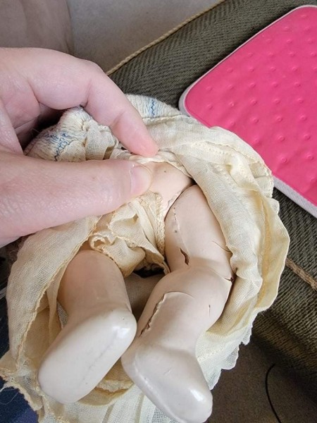 The legs of an old doll.