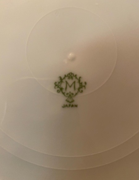 The marking on the back of a china plate.