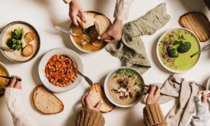 A collection of different soups at a party.