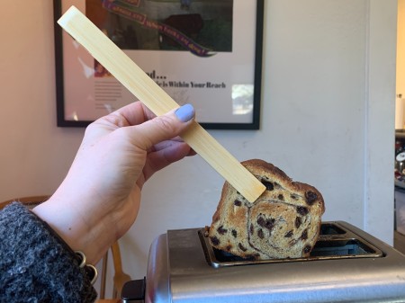 Using tongs for your toaster.
