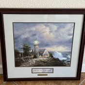 A framed Thomas Kinkade print.
I am the light of the world.
John 8:12