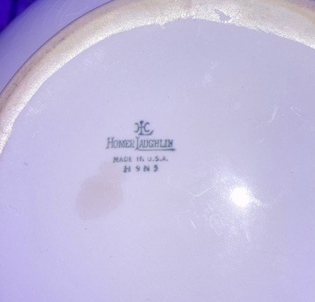 The Homer Laughlin manufacturing stamp on the bottom of a china dish.
