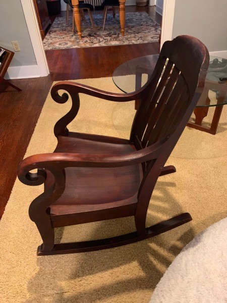 A wooden rocking chair.