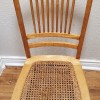 An old wooden chair with a wicker seat.