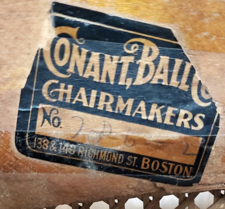 The Conant Ball manufacturer sticker on the underside of the chair.