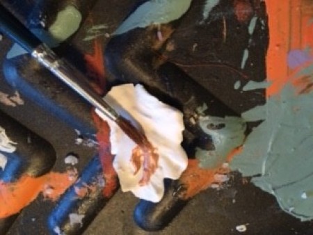 Painting color on the white flowers.