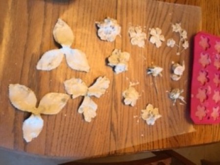 The silk flowers dipped in plaster of Paris.