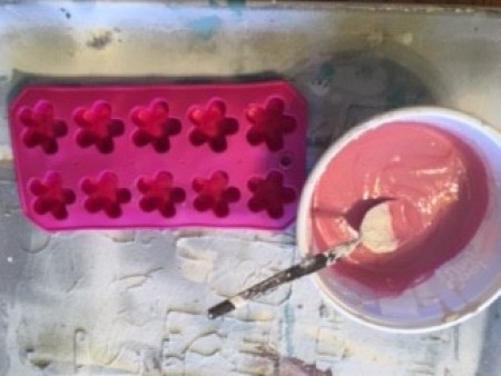 Making flower shapes using a silicone tray.