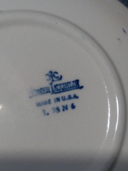 The marking on the back of a dish.