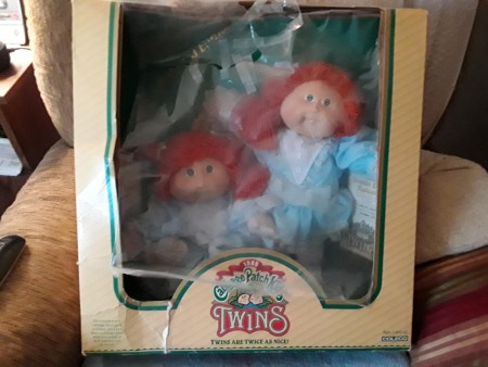 Two redheaded Cabbage Patch dolls.
