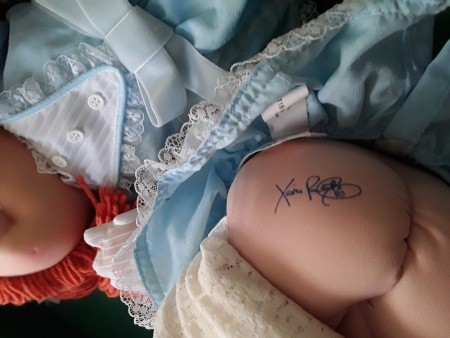 A signature on the Cabbage Patch doll.