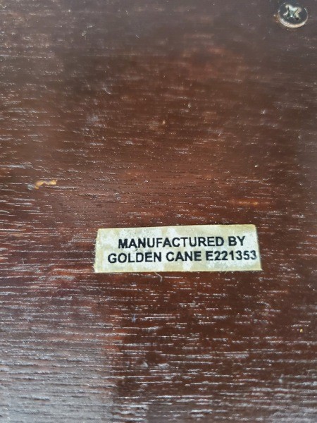 A sticker on the bottom of a lamp.