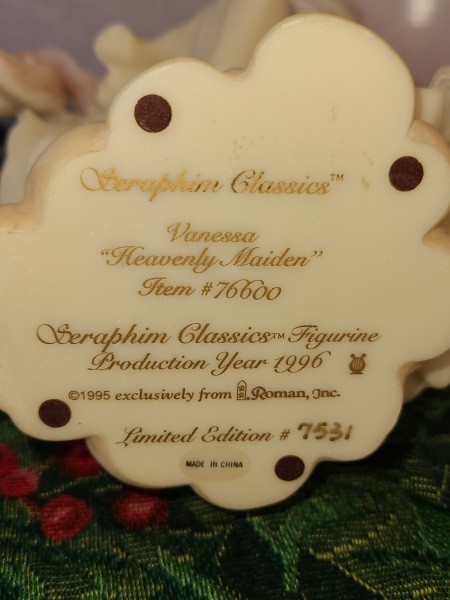 The writing on the underside of the figurine.