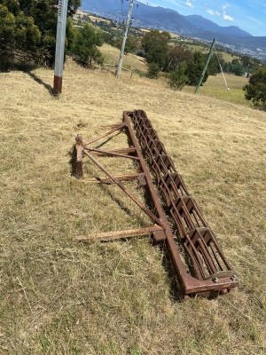 An old piece of rusty farm equipment.