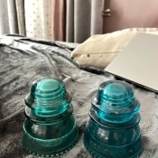 Two green glass insulators.