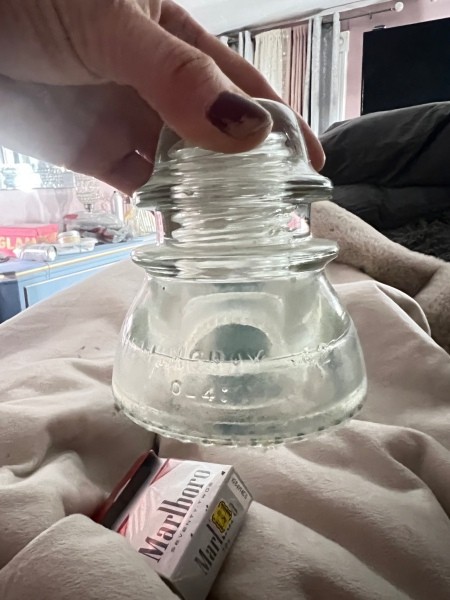 A clear glass insulator.