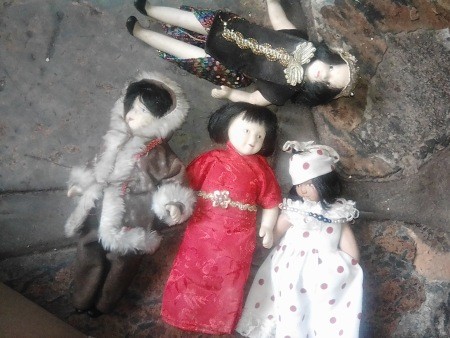 A collection of old porcelain dolls.