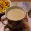 A cup of cheesy potato soup.