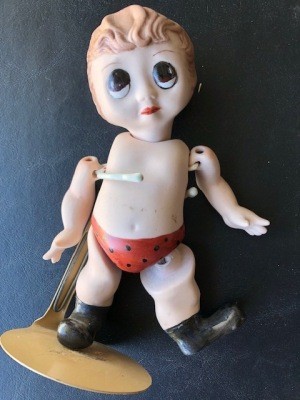 A doll without clothing.