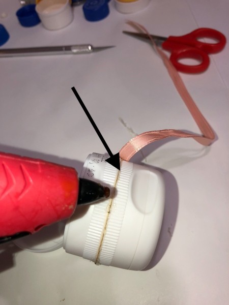 Adding ribbon to the seam.
