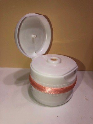 The completed spice container with the top lid open.