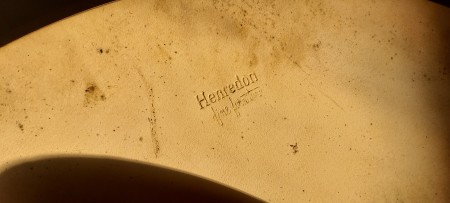 The manufacturer's mark on the underside of a table.