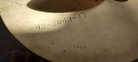 A serial number on the underside of a table.