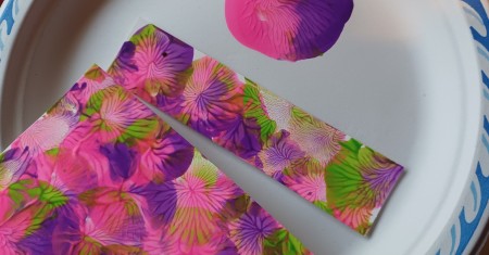 Cutting a bookmark from the end of the paper.